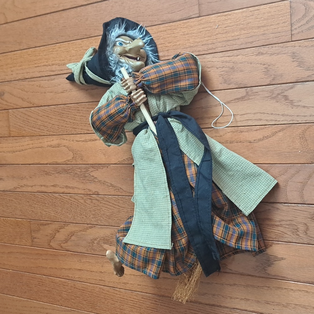 Halloween lovers, hanging decor of a witch on a broom stick